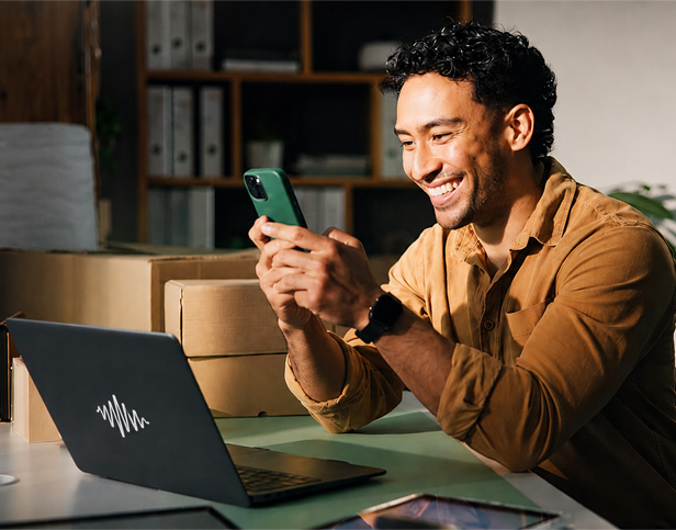 Man smiling at smart phone
