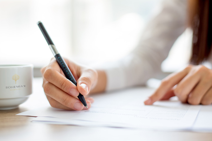 woman writing with pen