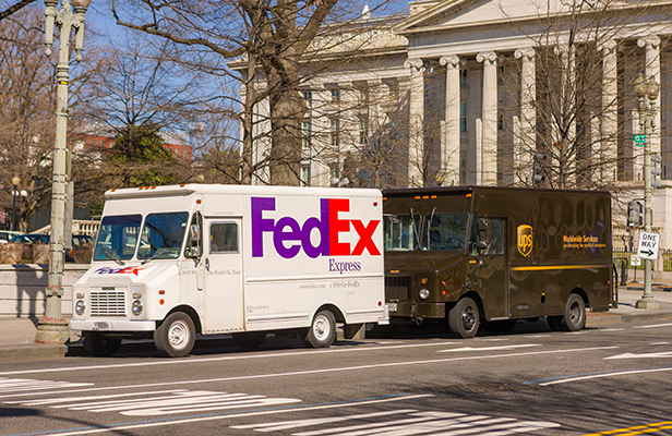 UPS and FedEx trucks