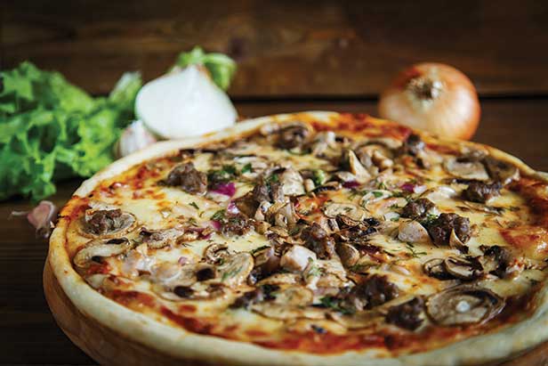 Thin crust sausage onion mushroom pizza