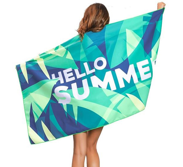 woman holding beach towel