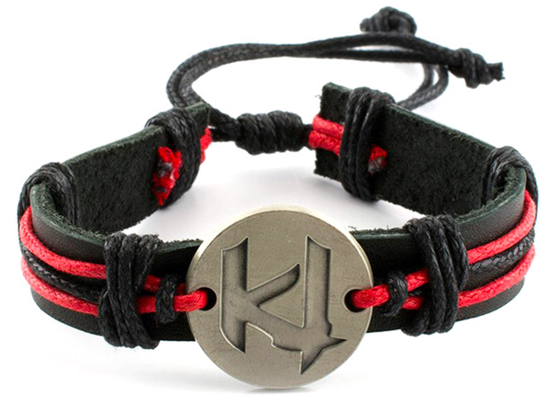 black and red braided leather wristband with charm in center