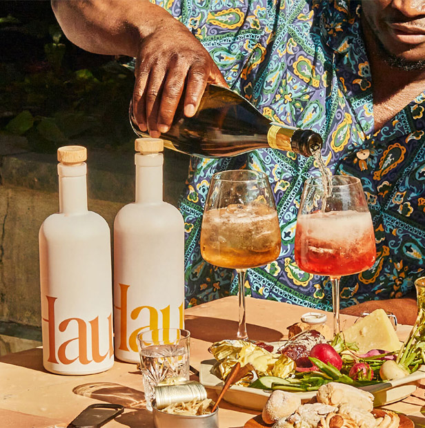 man pouring wine from bottle