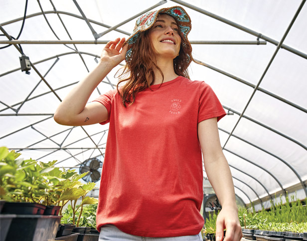 woman wearing red t-shirt and floral bucket hat