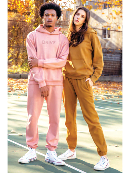 young man and woman wearing earth-colored sweat suits