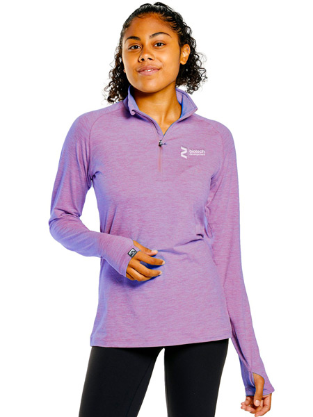 woman wearing purple quarter-zip pullover