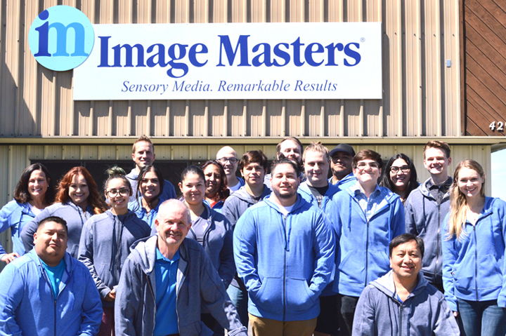 Image Masters staff outside building