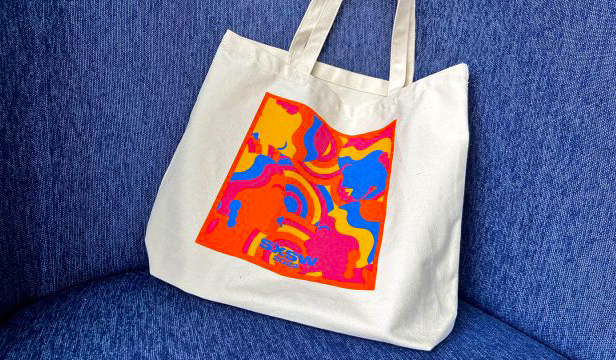 SXSW tote bag on blue chair