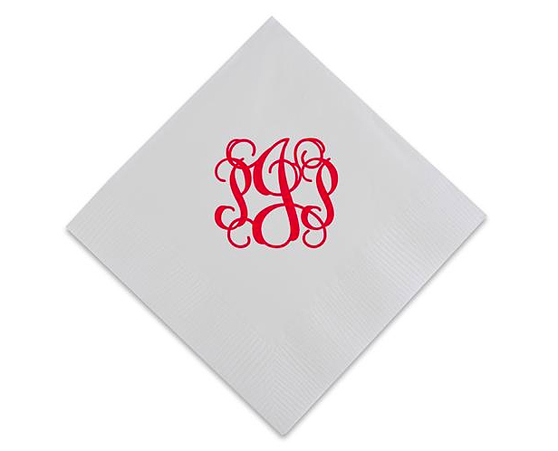 white napkin with red monogram design