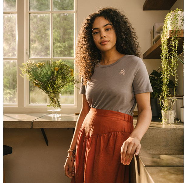 woman wearing unisex tee and skirt