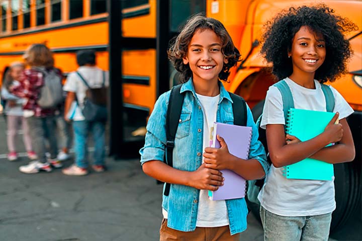 Young children at a bus stop