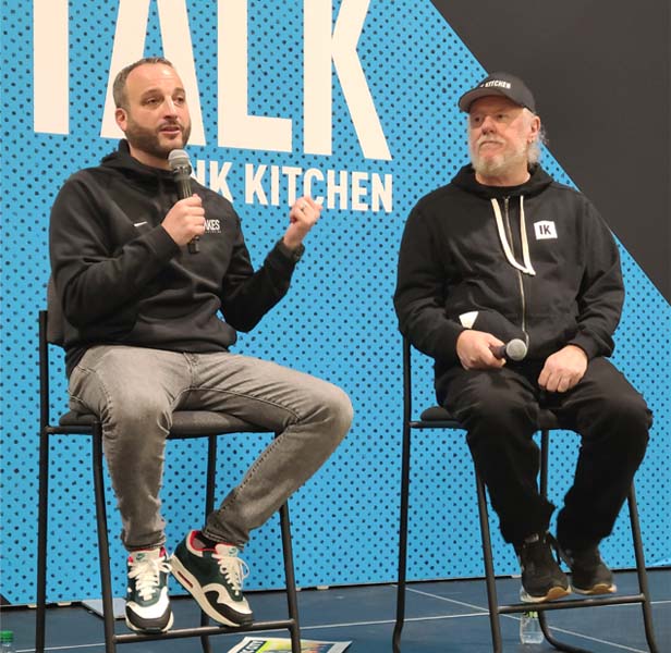 two men on stage talking