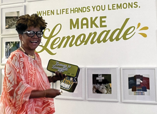 Nenette Gray holding speaker