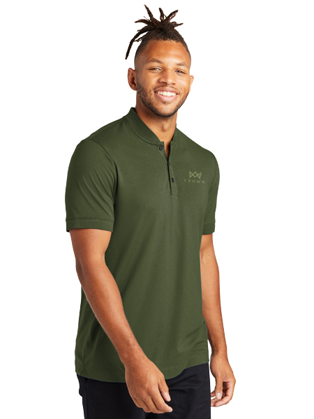 man wearing green polo shirt