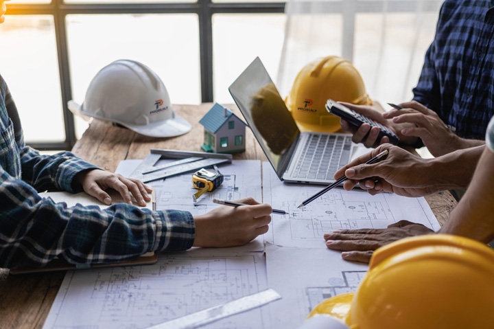 construction blueprints, hard hats