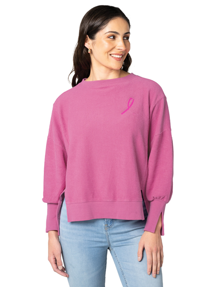 woman wearing pink crewneck