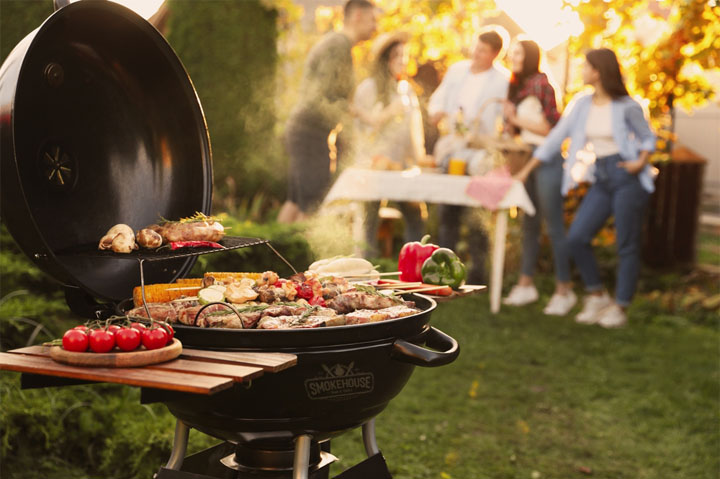 BBQ grill, people in background