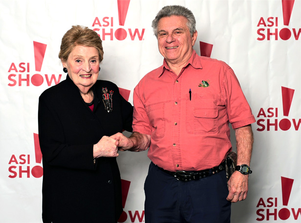 Lorne Ordel and Madeline Albright shaking hands at the ASI Show