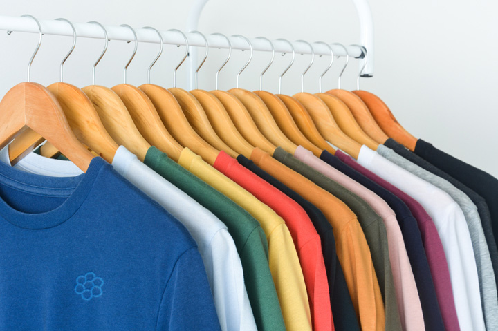 colorful t-shirts hanging on rack