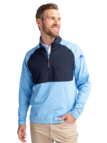 man wearing light blue and navy quarter-zip